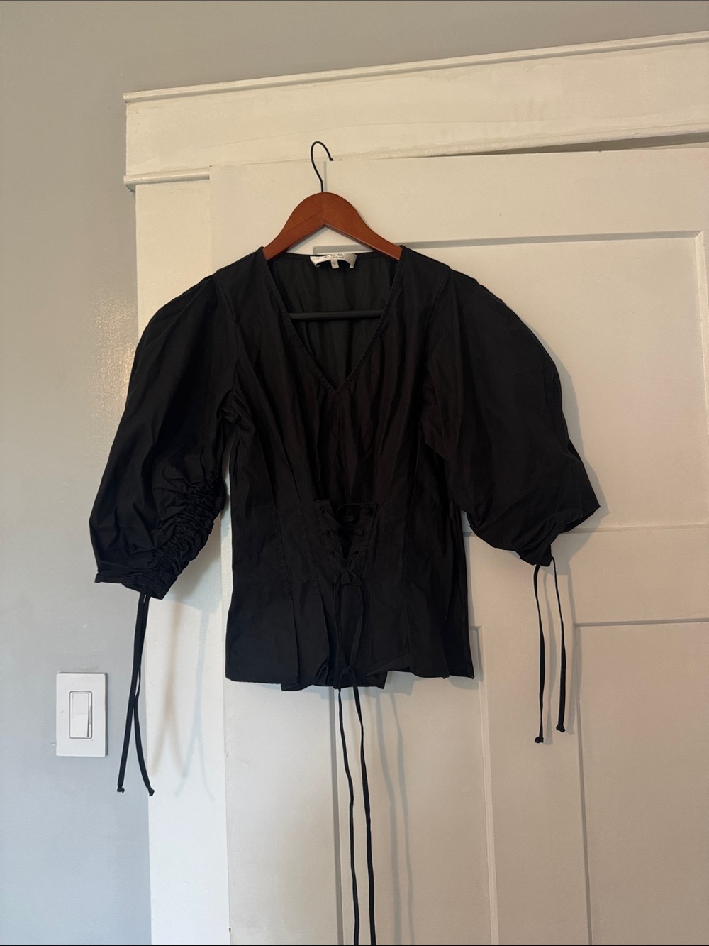 The most flattering black corset top